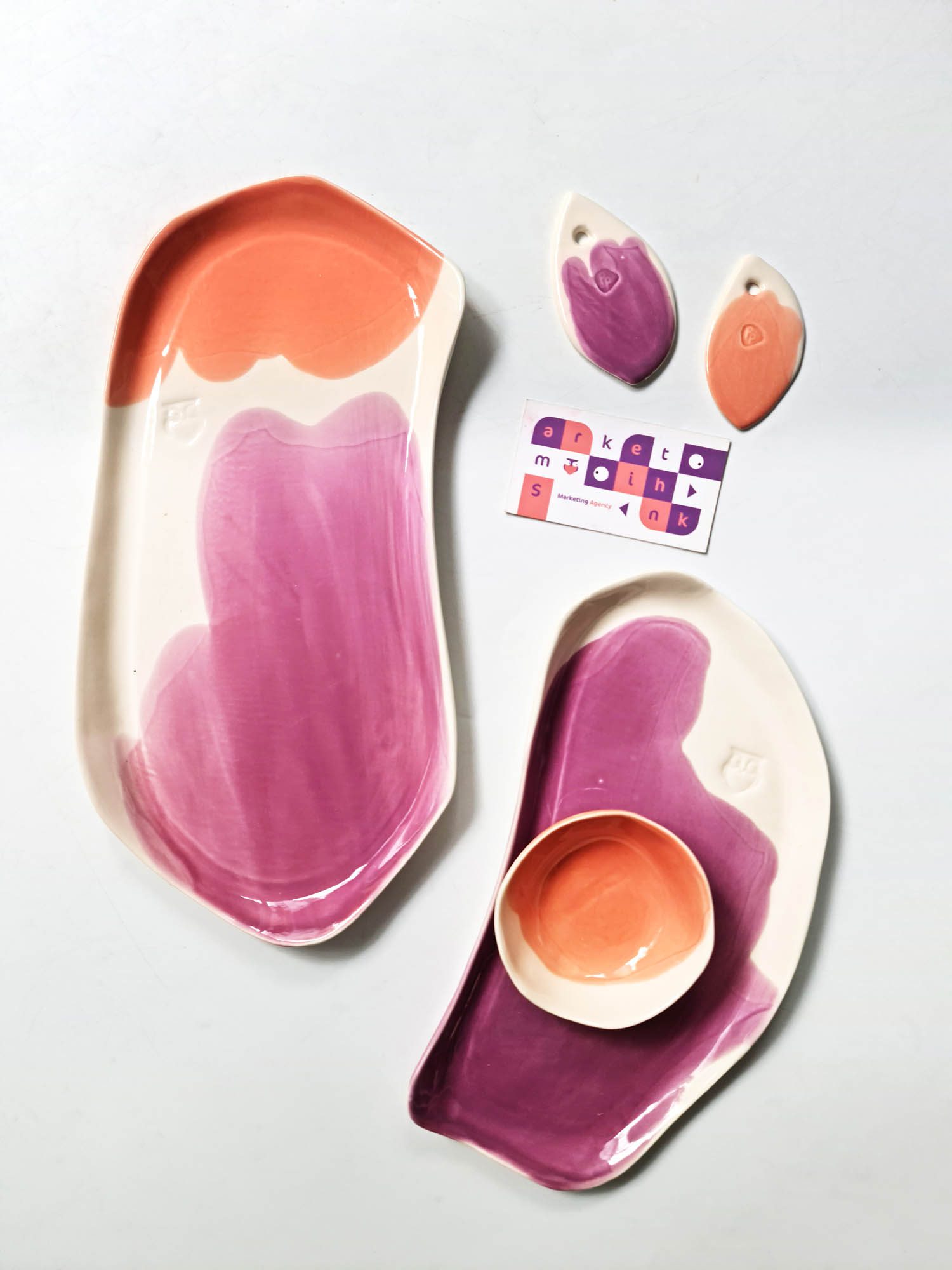 Custom porcelain plates and branded ceramic tags created for a corporate gift set.